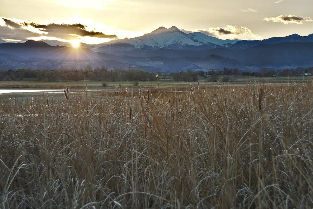 Sunset over McIntosh Lake in Longmont, CO, with Longs Peak on the skyline